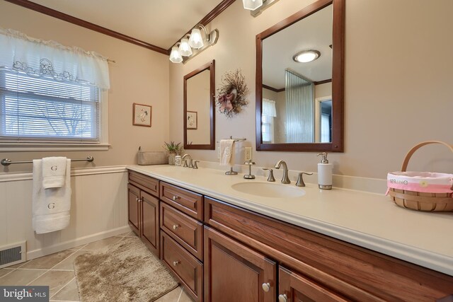 3902 Reiff Pl, Reading, PA 19606 - full bathroom featuring visible vents, ornamental molding, a sink, and tile patterned floors