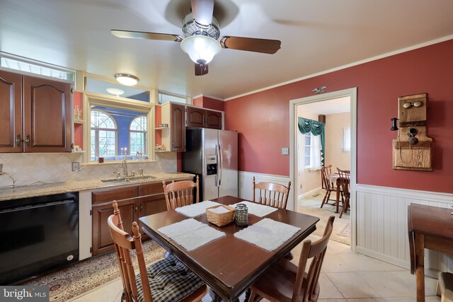 3902 Reiff Pl, Reading, PA 19606 - dining room with light tile patterned floors, ceiling fan, crown molding, and wainscoting