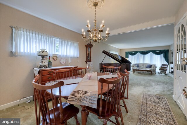 3902 Reiff Pl, Reading, PA 19606 - dining room with carpet flooring, a wealth of natural light, and an inviting chandelier