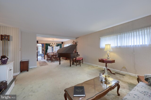 3902 Reiff Pl, Reading, PA 19606 - living room featuring baseboards, carpet flooring, and a notable chandelier