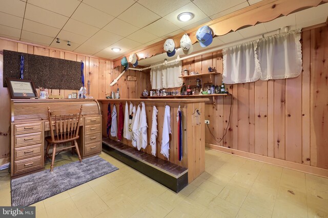 3902 Reiff Pl, Reading, PA 19606 - bathroom featuring tile patterned floors, wood walls, and baseboards