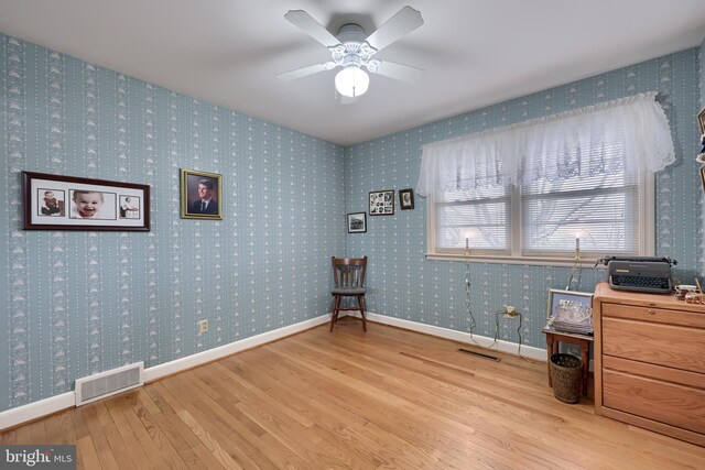 3902 Reiff Pl, Reading, PA 19606 - living area featuring baseboards, visible vents, wood finished floors, and wallpapered walls