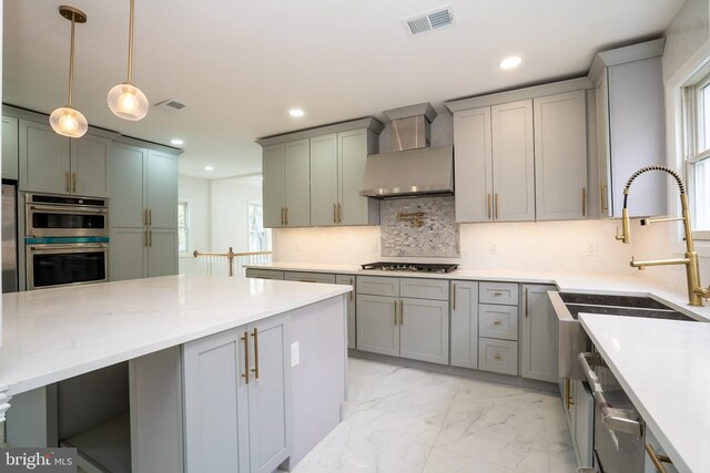 201 Morrison Ave, Hightstown, NJ 08520 - kitchen featuring gray cabinets, marble finish floor, visible vents, appliances with stainless steel finishes, and wall chimney exhaust hood