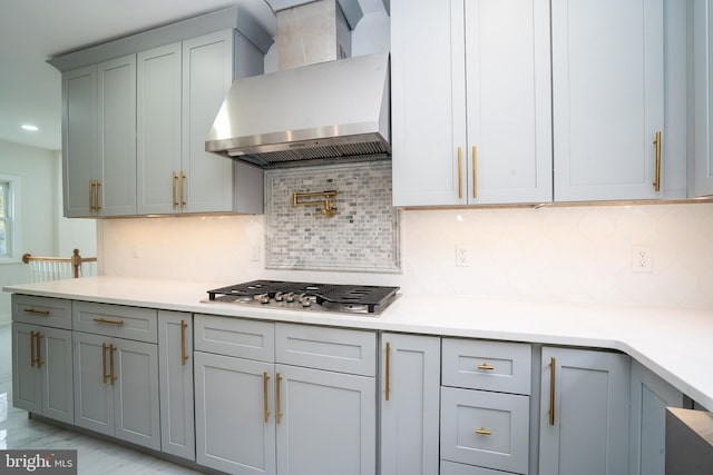 201 Morrison Ave, Hightstown, NJ 08520 - kitchen with wall chimney range hood, gray cabinets, stainless steel gas cooktop, and backsplash
