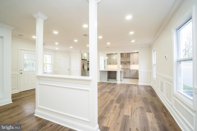 201 Morrison Ave, Hightstown, NJ 08520 - kitchen with crown molding, stainless steel fridge with ice dispenser, dark wood-style floors, a decorative wall, and ornate columns