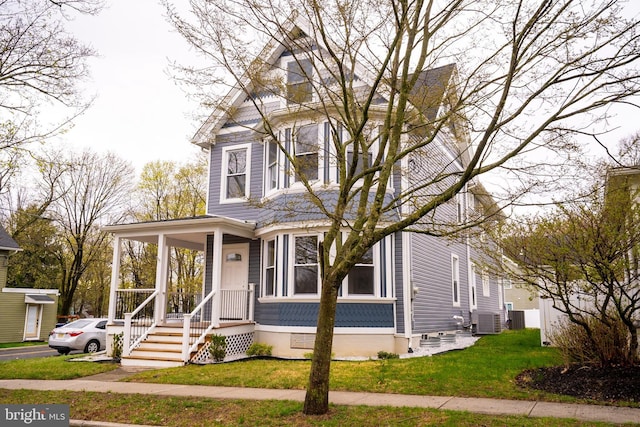201 Morrison Ave, Hightstown, NJ 08520 - victorian-style house featuring cooling unit, covered porch, and a front lawn