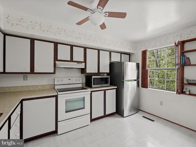30 Drawbridge Ct, Baltimore, MD 21228 - kitchen with open shelves, light countertops, stainless steel appliances, under cabinet range hood, and visible vents