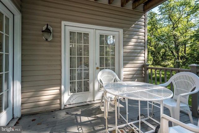 wooden deck with outdoor dining area