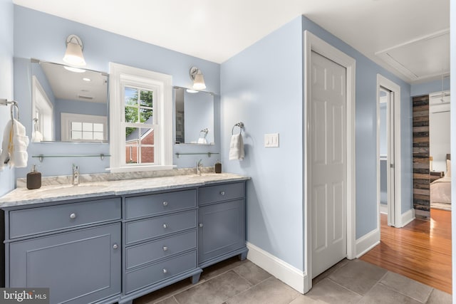 2819 S Joyce St, Arlington, VA 22202 - bathroom with tile patterned flooring, baseboards, and double vanity