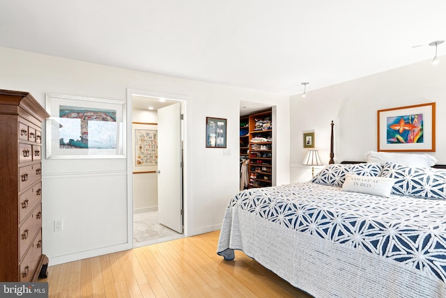 2001 Hamilton St Unit 1914, Philadelphia, PA 19130 - bedroom with light wood-style flooring, a walk in closet, and a closet
