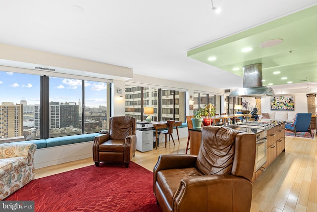 2001 Hamilton St Unit 1914, Philadelphia, PA 19130 - living area featuring light wood-type flooring, recessed lighting, and a city view