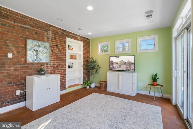 sitting room featuring recessed lighting, visible vents, baseboards, and built in features