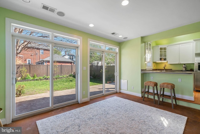interior space with recessed lighting, visible vents, and baseboards