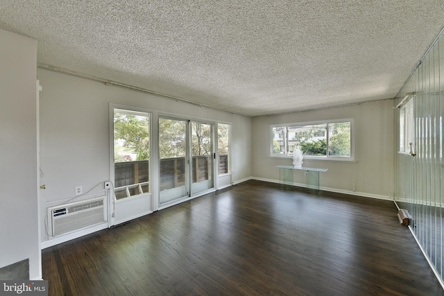 1556 Coolidge Ave, Abington, PA 19001 - empty room featuring wood finished floors, a textured ceiling, and an AC wall unit