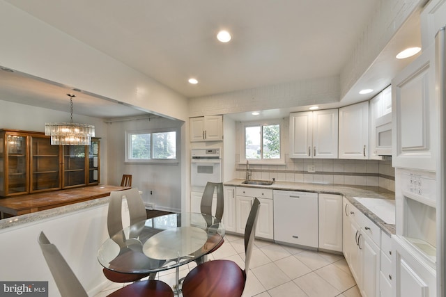 1556 Coolidge Ave, Abington, PA 19001 - kitchen featuring white appliances, recessed lighting, decorative backsplash, white cabinets, and light tile patterned floors