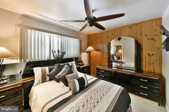 1556 Coolidge Ave, Abington, PA 19001 - carpeted bedroom with wooden walls, arched walkways, and ceiling fan