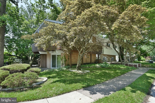 1556 Coolidge Ave, Abington, PA 19001 - obstructed view of property with a front yard and brick siding