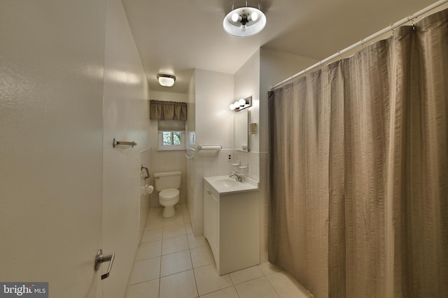 1556 Coolidge Ave, Abington, PA 19001 - bathroom with tile patterned flooring, tile walls, vanity, and wainscoting