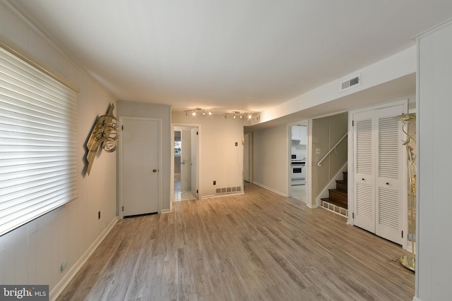 1556 Coolidge Ave, Abington, PA 19001 - unfurnished living room featuring light wood-style flooring, stairway, and track lighting