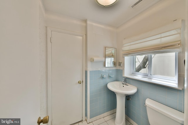 1556 Coolidge Ave, Abington, PA 19001 - bathroom featuring tile walls, tile patterned flooring, and a wainscoted wall