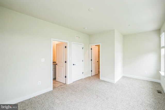 4418 Roland Heights Ave, Baltimore, MD 21211 - unfurnished bedroom featuring light colored carpet and baseboards
