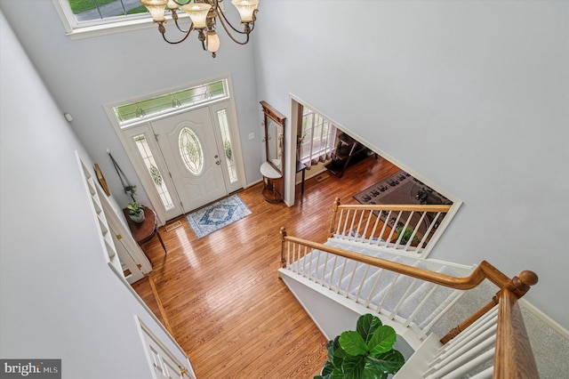 100 Fernwood Dr, Avondale, PA 19311 - entryway with a towering ceiling, wood finished floors, baseboards, stairway, and a chandelier