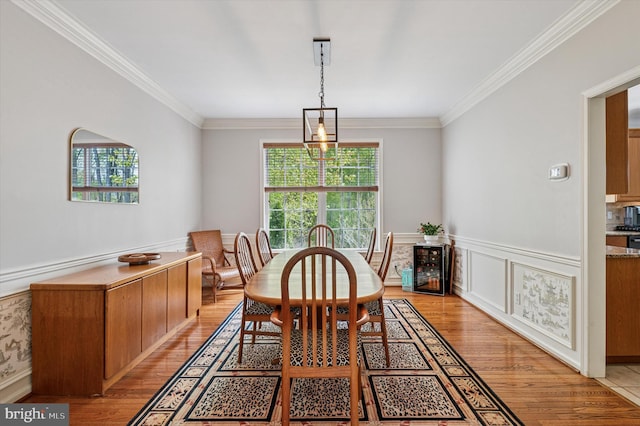 100 Fernwood Dr, Avondale, PA 19311 - dining space featuring light wood-style floors, crown molding, and wainscoting