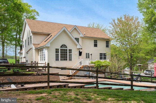 100 Fernwood Dr, Avondale, PA 19311 - view of front facade featuring roof with shingles and an outdoor pool