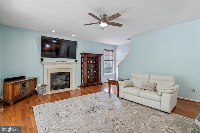 100 Fernwood Dr, Avondale, PA 19311 - living room featuring wood finished floors, baseboards, ceiling fan, recessed lighting, and a fireplace with flush hearth