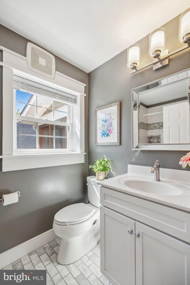 bathroom with vanity and toilet
