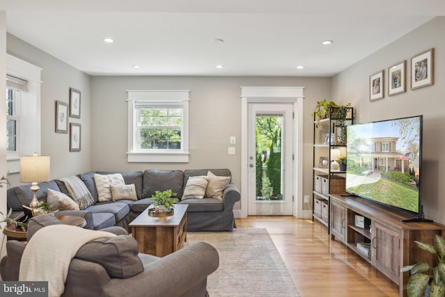 living room with recessed lighting and light wood finished floors