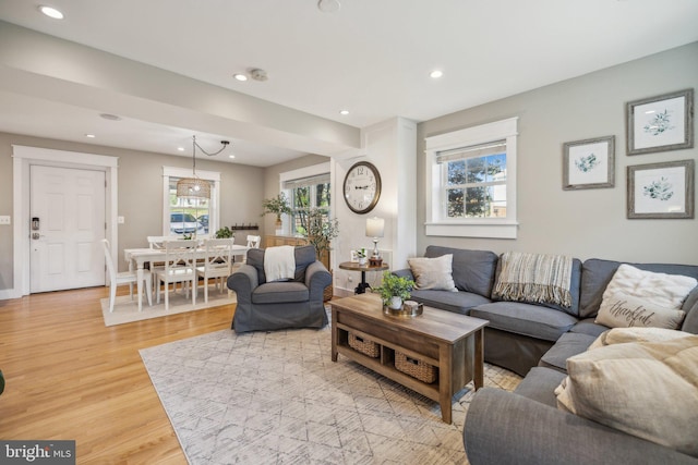 living area featuring recessed lighting and light wood finished floors