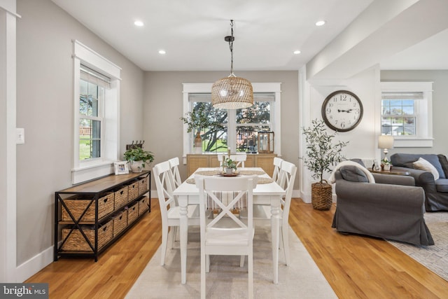 dining room featuring recessed lighting, baseboards, and light wood-type flooring