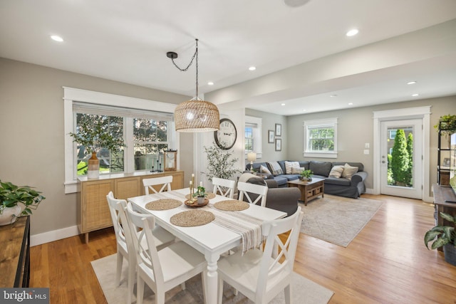 dining space with recessed lighting, baseboards, and light wood-style floors