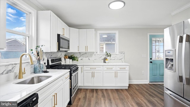 2910 Salisbury Ave, Baltimore, MD 21219 - kitchen featuring dark wood-style floors, backsplash, light stone countertops, appliances with stainless steel finishes, and a sink