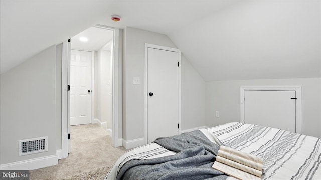 2910 Salisbury Ave, Baltimore, MD 21219 - bedroom featuring light carpet, visible vents, baseboards, and vaulted ceiling