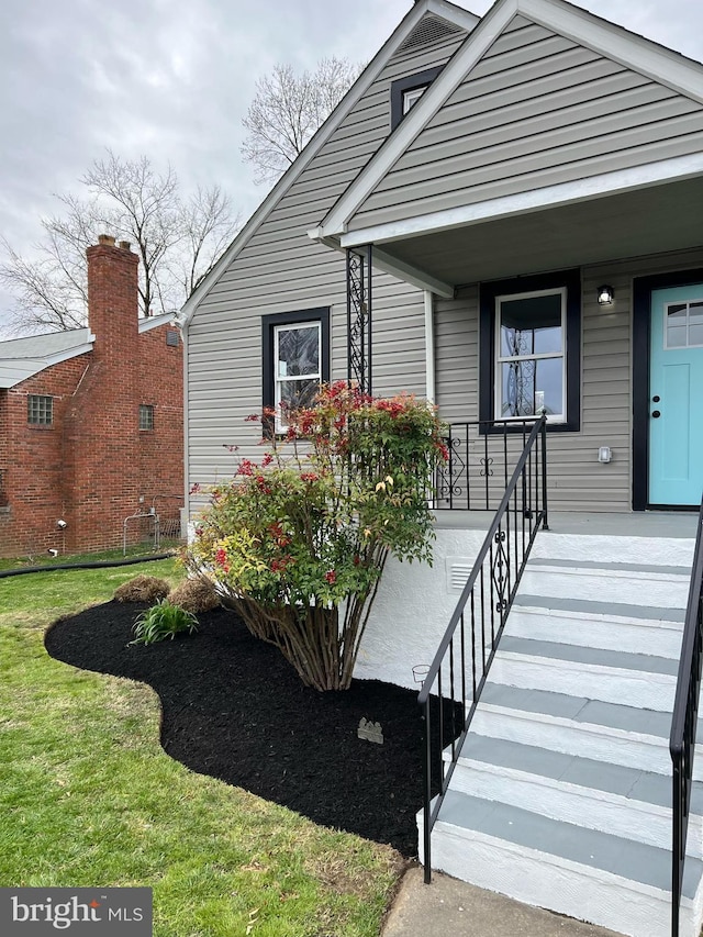 2910 Salisbury Ave, Baltimore, MD 21219 - view of exterior entry featuring a porch and a yard