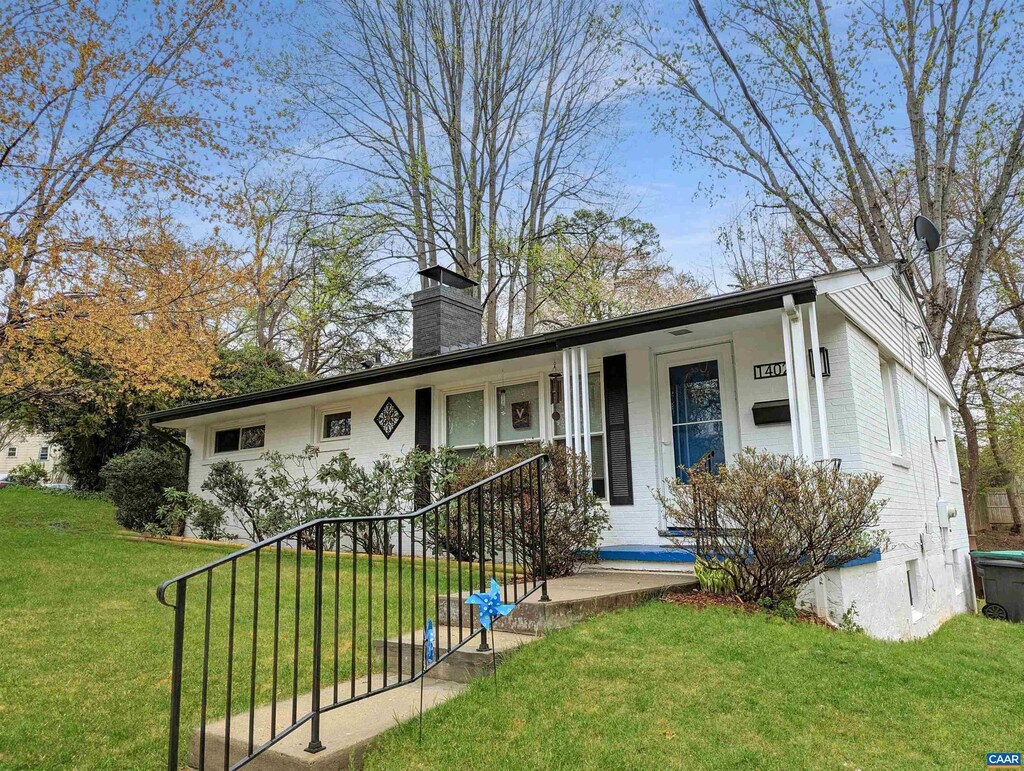 1402 Baker St, Charlottesville, VA 22903 - single story home with a front lawn, a chimney, covered porch, and brick siding