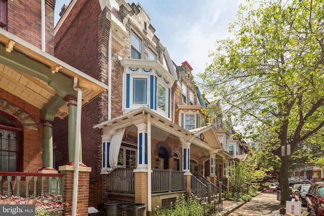 225 Buckingham Pl, Philadelphia, PA 19104 - view of side of property featuring covered porch and brick siding