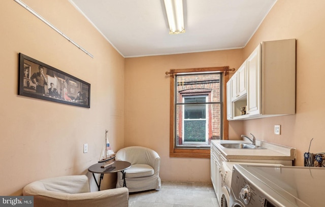 225 Buckingham Pl, Philadelphia, PA 19104 - laundry room featuring crown molding, a sink, cabinet space, and washing machine and clothes dryer