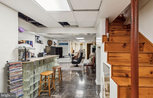 225 Buckingham Pl, Philadelphia, PA 19104 - bar featuring a bar, a paneled ceiling, and stairs