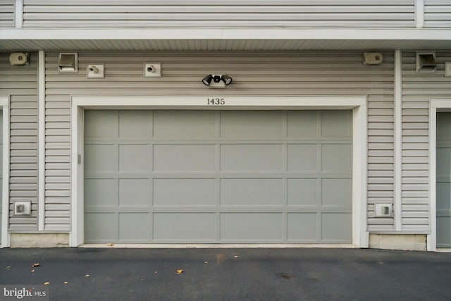 1435 S Lawrence Ter Unit 48, Philadelphia, PA 19147 - garage featuring aphalt driveway