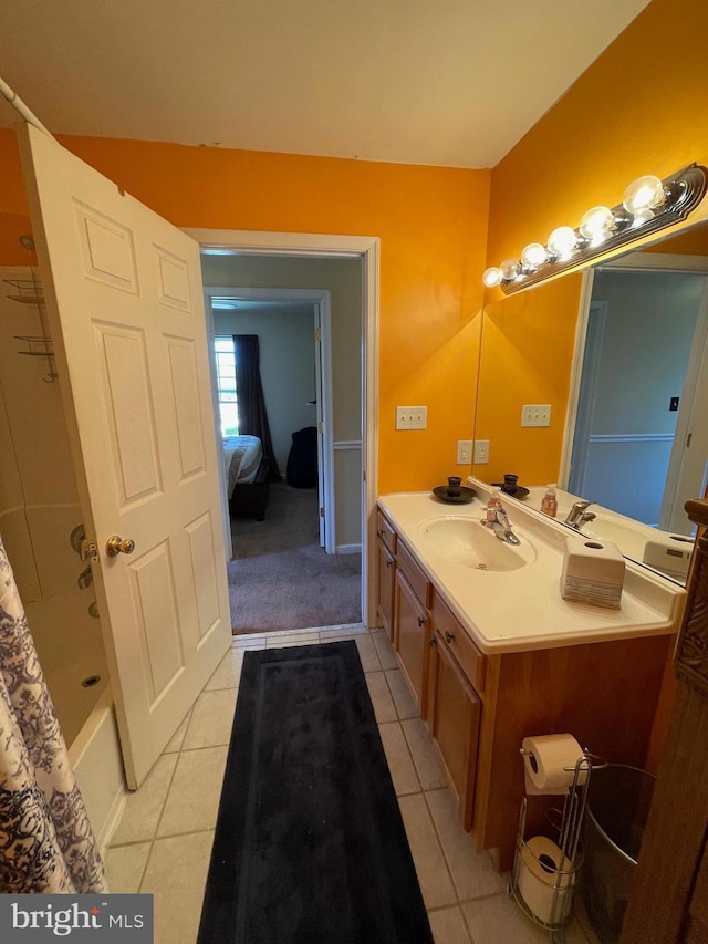 full bath featuring vanity, tile patterned flooring, and shower / tub combo with curtain