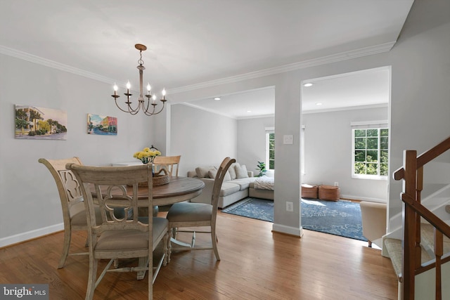 10945 Harpers Square Ct, Reston, VA 20191 - dining area with stairway, wood finished floors, a chandelier, baseboards, and crown molding