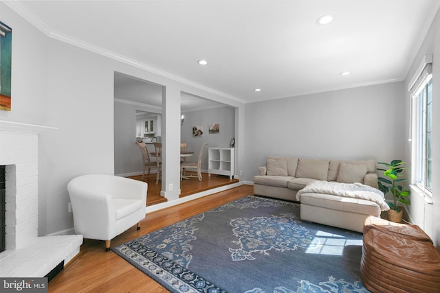 10945 Harpers Square Ct, Reston, VA 20191 - living area featuring wood finished floors, recessed lighting, a fireplace, crown molding, and baseboards