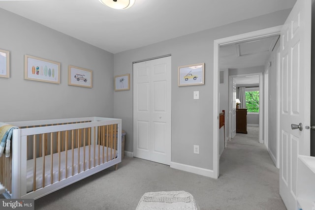 10945 Harpers Square Ct, Reston, VA 20191 - carpeted bedroom with a closet, baseboards, attic access, and a nursery area