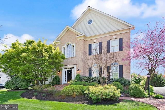 43005 Running Ridge Way, Leesburg, VA 20176 - colonial house with brick siding and a front yard