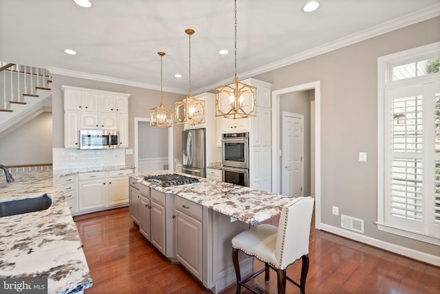 43005 Running Ridge Way, Leesburg, VA 20176 - kitchen with stainless steel appliances, a sink, a chandelier, light stone counters, and recessed lighting