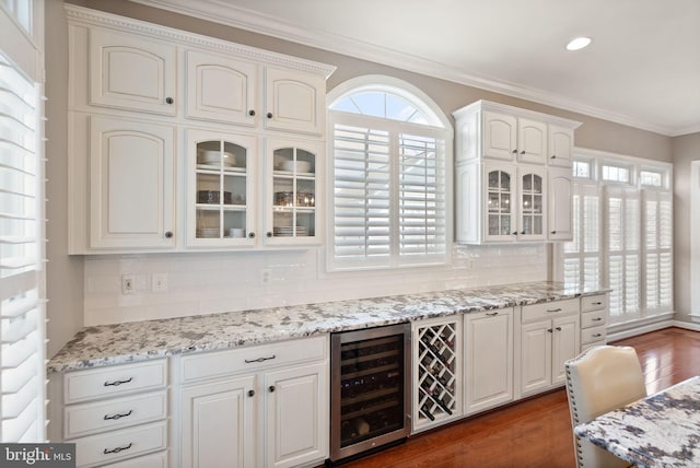 43005 Running Ridge Way, Leesburg, VA 20176 - bar featuring wine cooler, healthy amount of natural light, decorative backsplash, crown molding, and recessed lighting