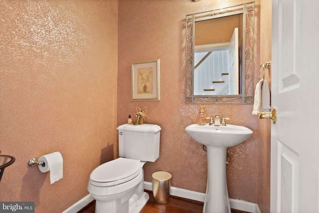 43005 Running Ridge Way, Leesburg, VA 20176 - half bathroom with toilet, wood finished floors, and baseboards